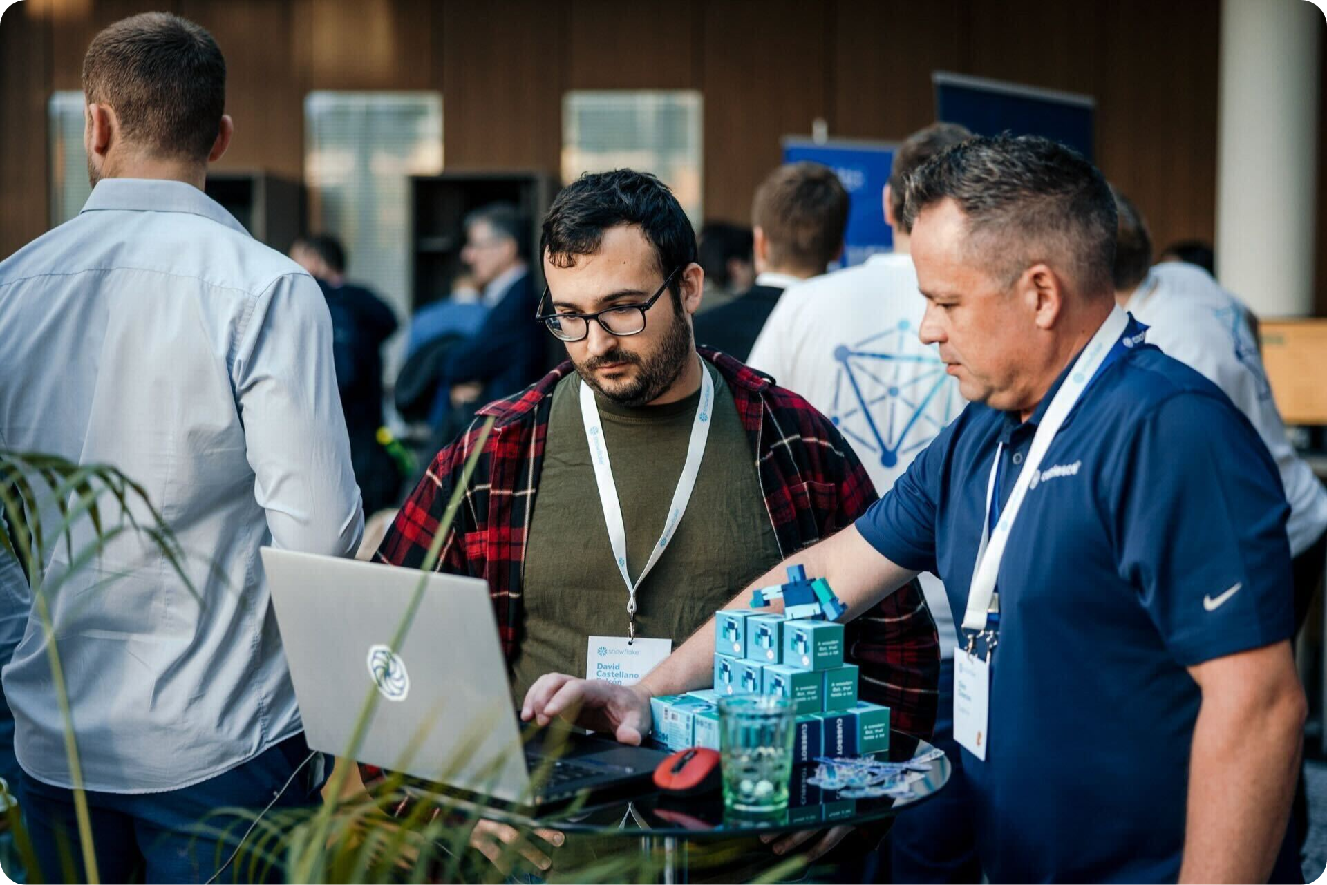 Coalesce team member demonstrates software platform on laptop at industry event